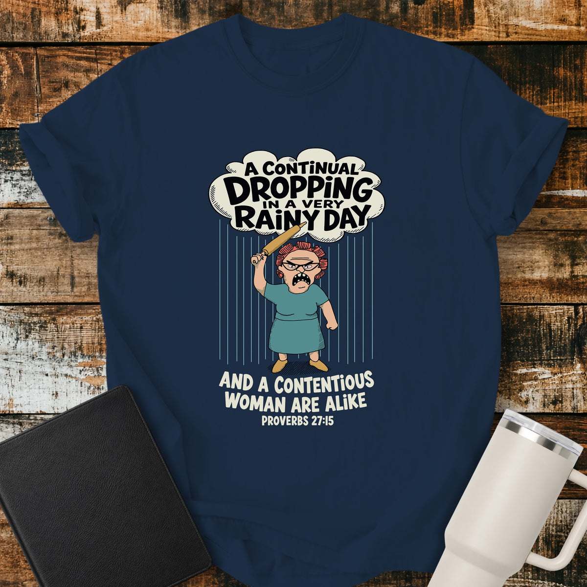 true navy blue Christian t-shirt featuring a humorous illustration inspired by Proverbs 27:15, with the verse “A continual dropping in a very rainy day and a contentious woman are alike.”