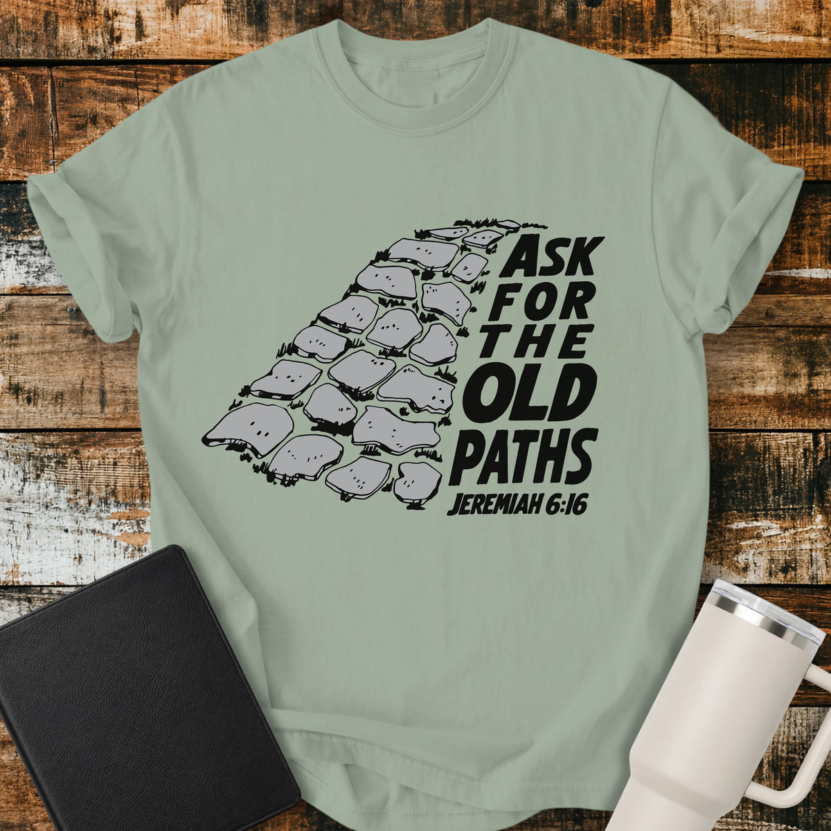 bay green Christian t-shirt featuring a vintage stone pathway illustration with bold retro lettering reading “Ask for the Old Paths” and Jeremiah 6:16.