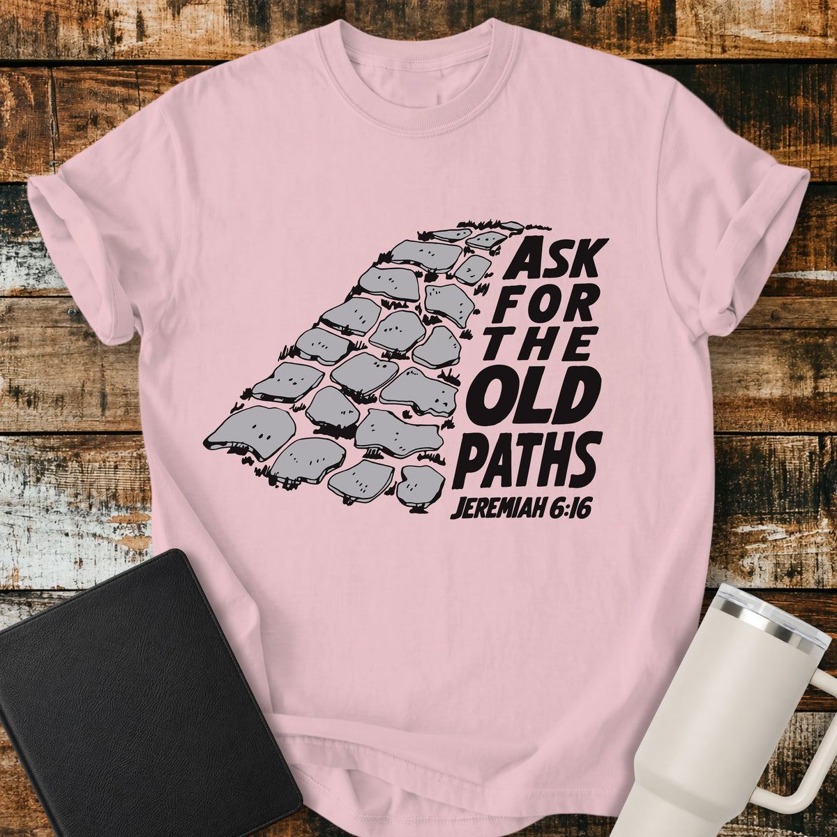 blossom pink Christian t-shirt featuring a vintage stone pathway illustration with bold retro lettering reading “Ask for the Old Paths” and Jeremiah 6:16.