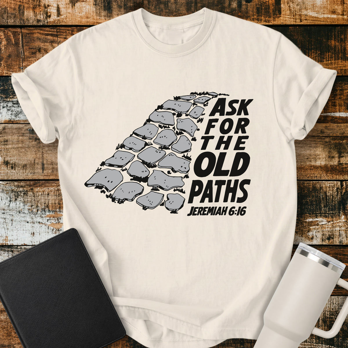 ivory Christian t-shirt featuring a vintage stone pathway illustration with bold retro lettering reading “Ask for the Old Paths” and Jeremiah 6:16.