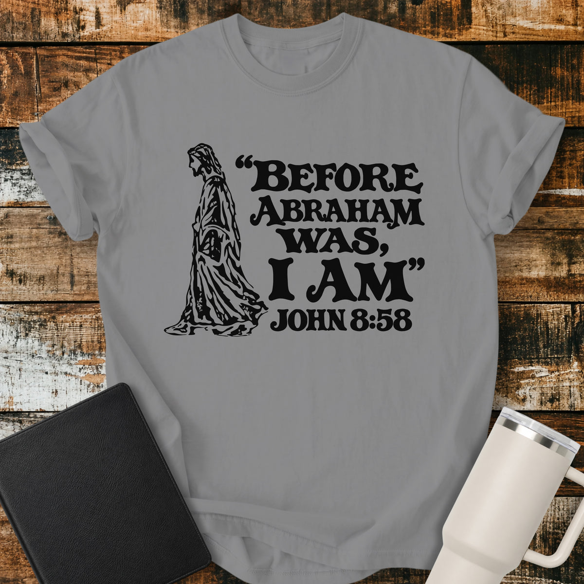 Grey Christian T-shirt featuring a vintage-style illustration of Jesus alongside the bold words, “BEFORE ABRAHAM WAS, I AM,” with the Bible reference “JOHN 8:58.”