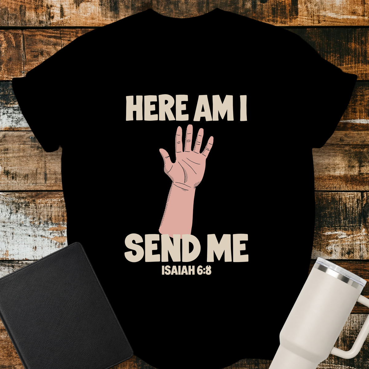 black Christian T-shirt featuring a raised hand with the words “Here Am I Send Me” and “Isaiah 6:8” in cream lettering.