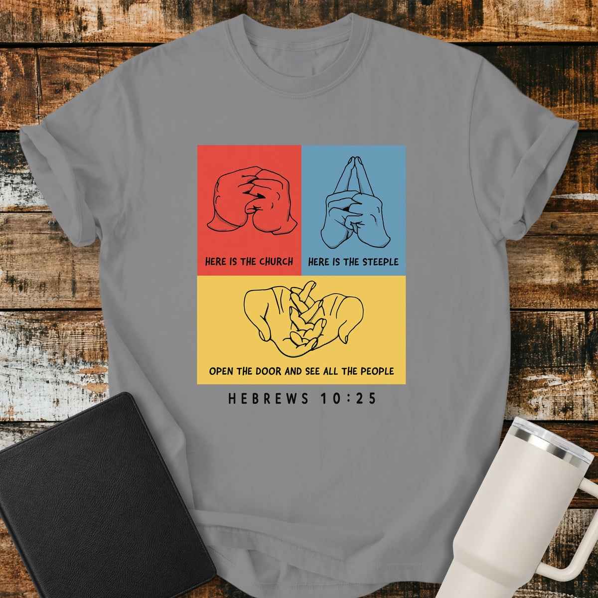 grey Christian t-shirt featuring a three-panel hand illustration of the classic “Here Is the Church, Here Is the Steeple, Open the Door and See All the People” finger rhyme, paired with Hebrews 10:25.