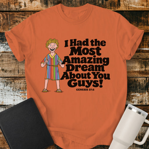 burnt orange Christian T-shirt featuring Joseph in a colorful coat with the humorous phrase “I Had the Most Amazing Dream About You Guys!” and “Genesis 37:5” in black lettering.