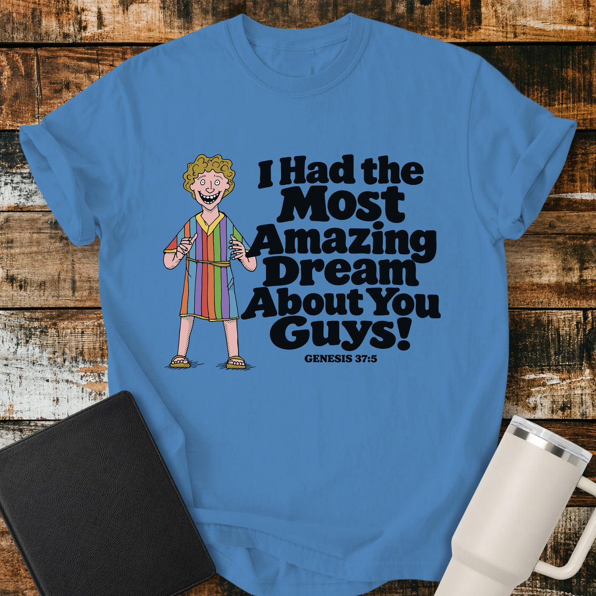 royal caribe blue Christian T-shirt featuring Joseph in a colorful coat with the humorous phrase “I Had the Most Amazing Dream About You Guys!” and “Genesis 37:5” in black lettering.