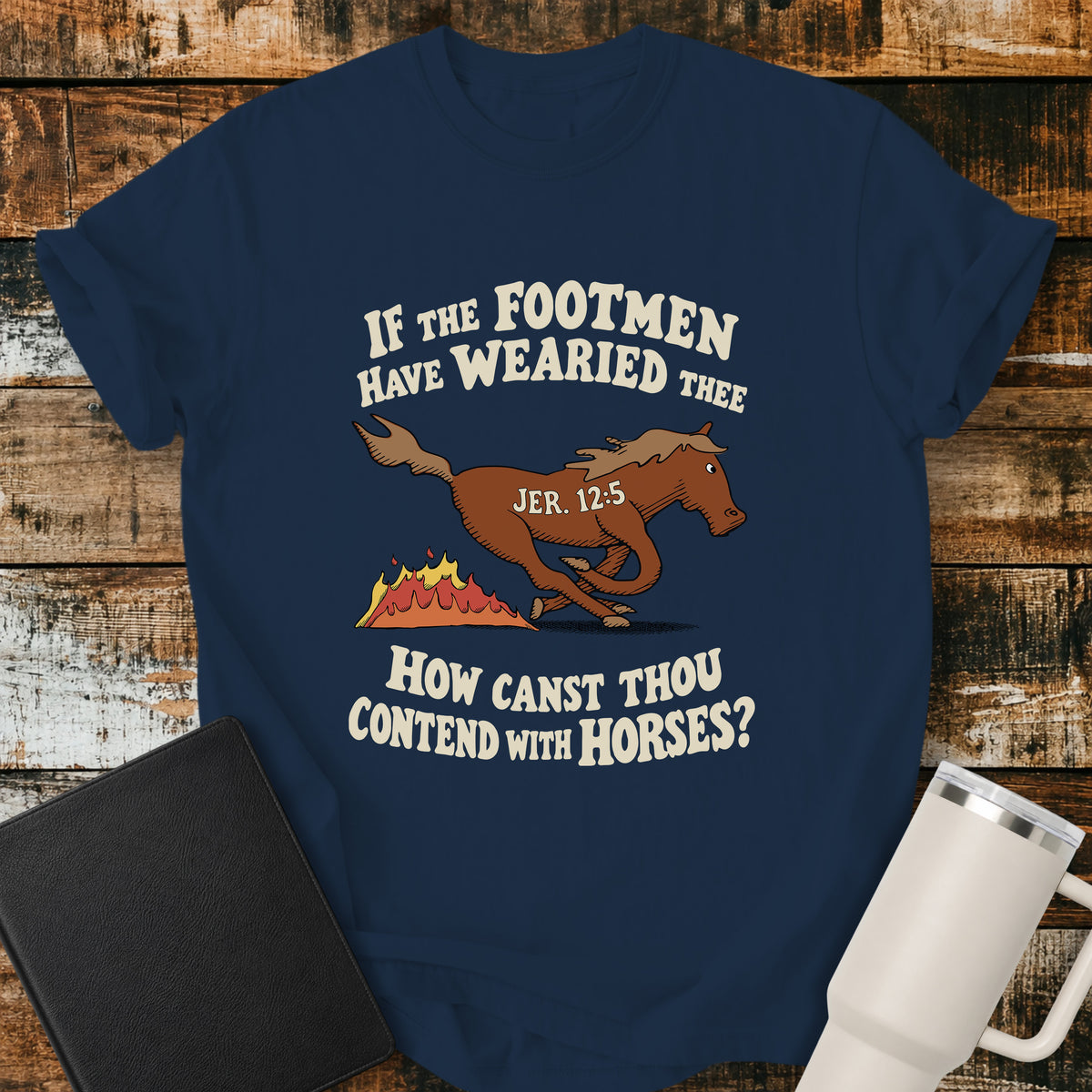 true navy blue Christian T-shirt featuring a running horse and flames with the words “If the Footmen Have Wearied Thee, How Canst Thou Contend With Horses?” and “Jer. 12:5."