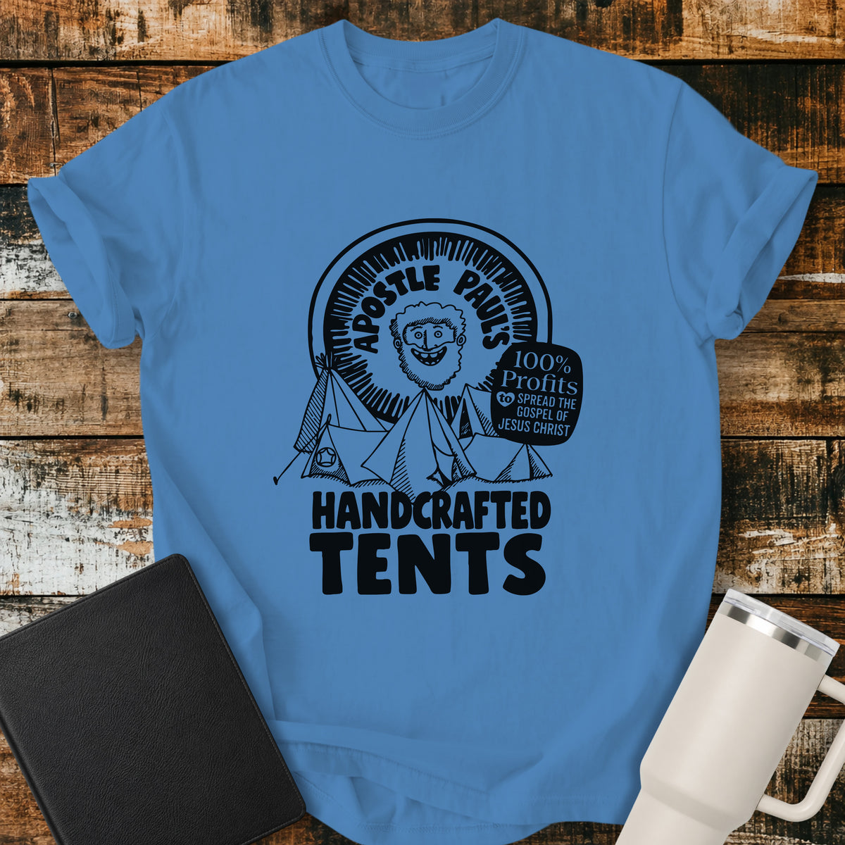 royal caribe blue Christian T-shirt featuring Apostle Paul with handcrafted tents and the words “100% Profits to Spread the Gospel of Jesus Christ.”