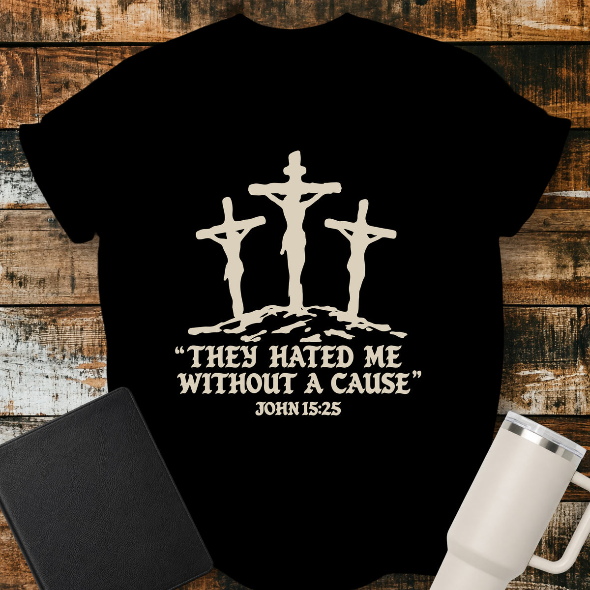 black Christian T-shirt featuring three crosses with the words “They Hated Me Without a Cause” and “John 15:25” in cream lettering.