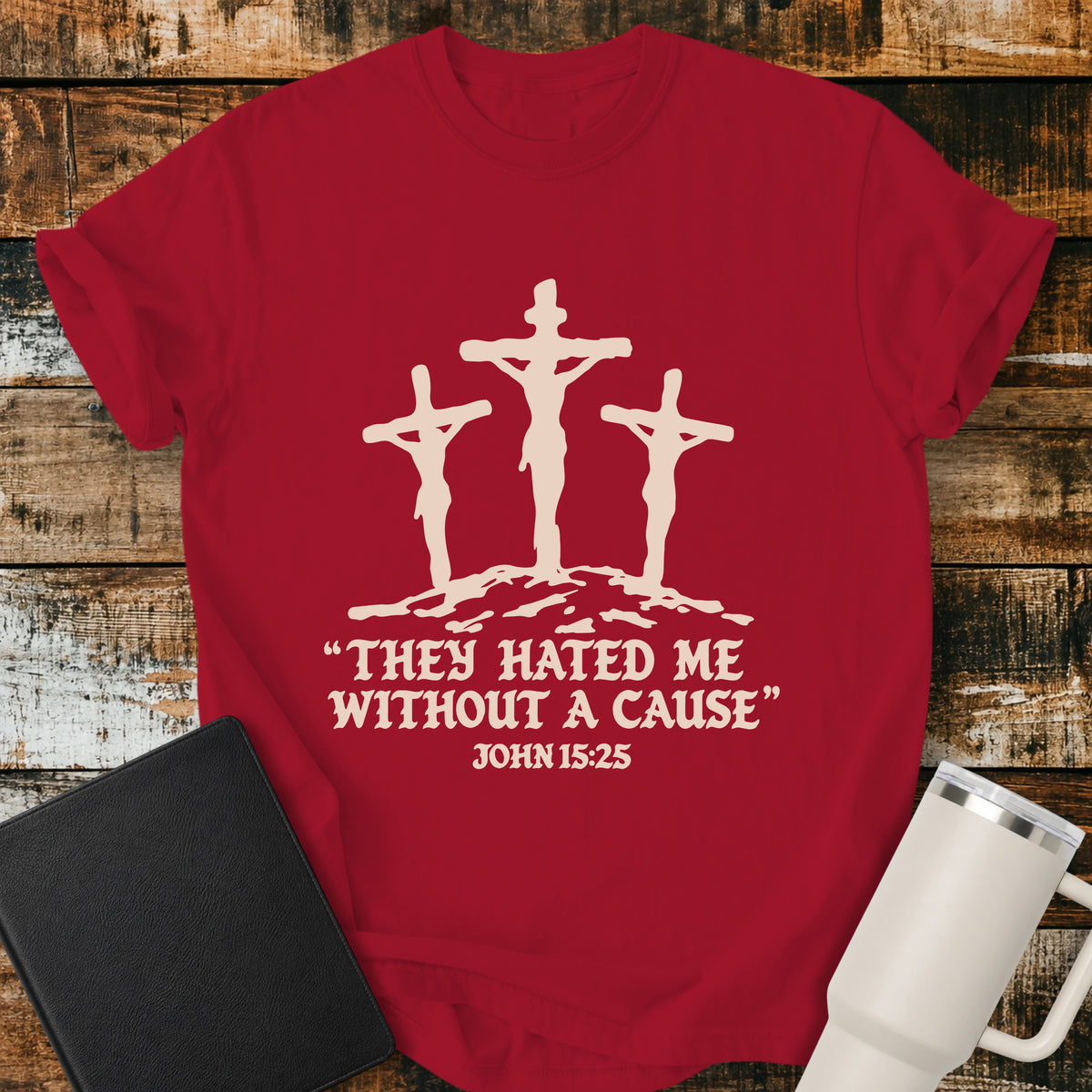red Christian T-shirt featuring three crosses with the words “They Hated Me Without a Cause” and “John 15:25” in cream lettering.